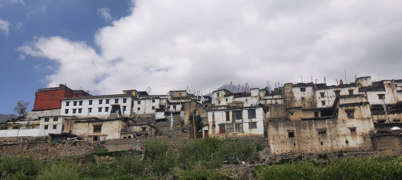 Upper Mustang traditional village with whitewashed houses and Himalayan landscape